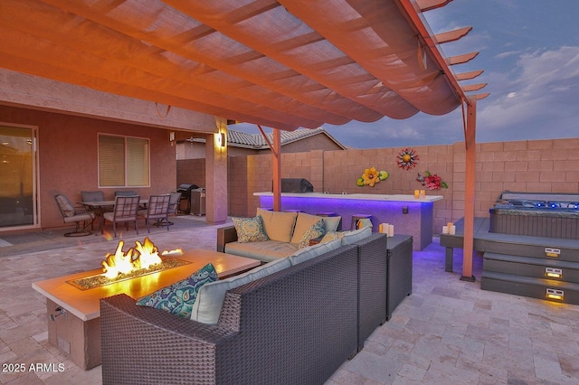 view of patio featuring fence, a pergola, grilling area, an outdoor living space with a fire pit, and a hot tub
