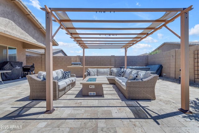view of patio / terrace with grilling area, a pergola, a fenced backyard, and an outdoor living space with a fire pit