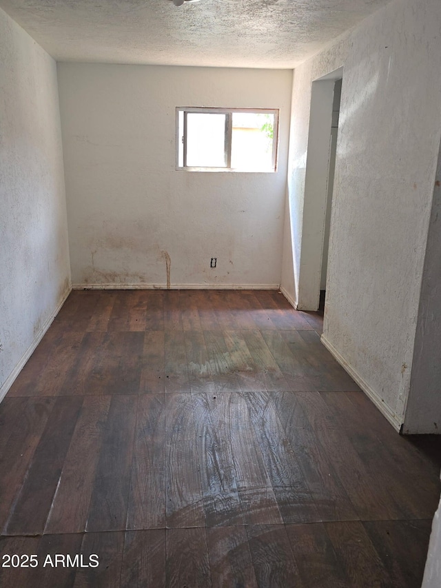 813 N Berry Ave, Winslow, AZ 86047 - spare room with hardwood / wood-style floors and baseboards
