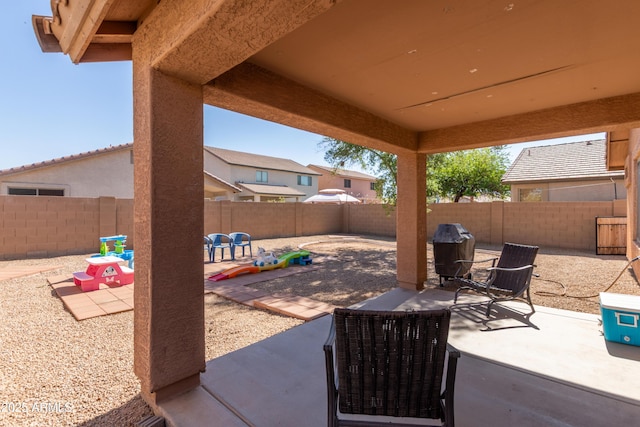4817 W St Charles Ave, Laveen, AZ 85339 - fenced backyard with a patio area and a grill