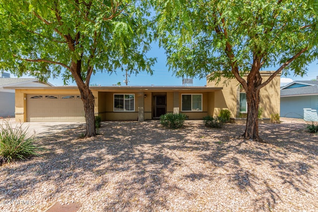 single story home with a garage