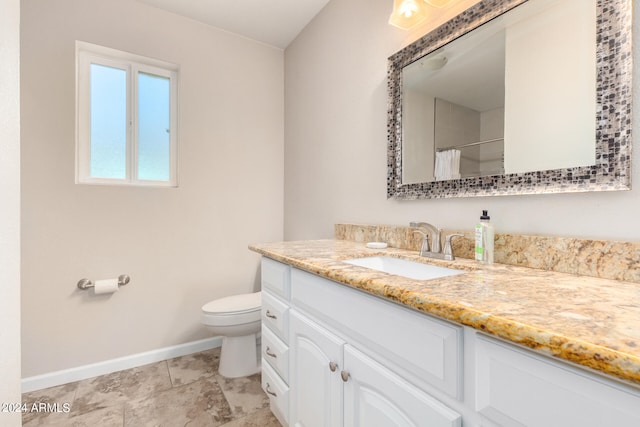 bathroom with tile patterned floors, vanity, and toilet