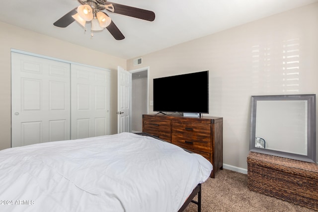 bedroom featuring a closet, ceiling fan, and carpet floors