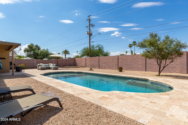 view of swimming pool featuring a patio and an outdoor hangout area