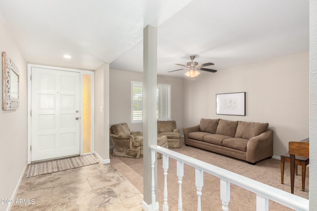 entryway featuring ceiling fan and light tile patterned floors