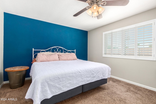 bedroom with ceiling fan and carpet floors