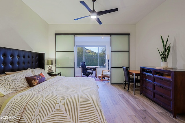 bedroom with a ceiling fan and wood finished floors