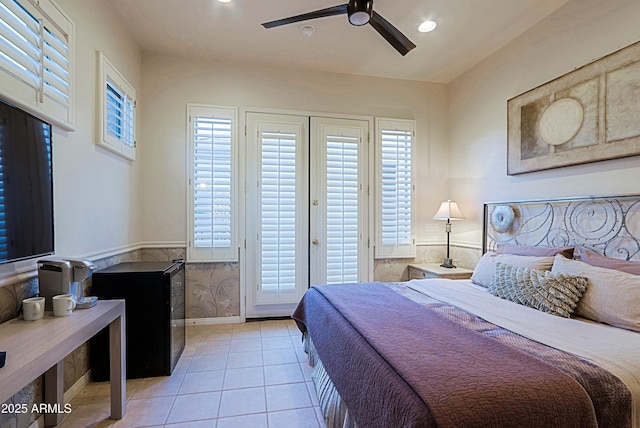 bedroom featuring recessed lighting, light tile patterned floors, multiple windows, and access to exterior