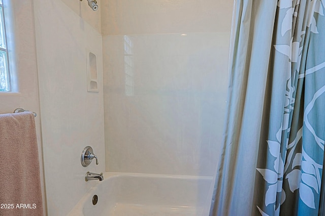 full bathroom with shower / bath combo with shower curtain