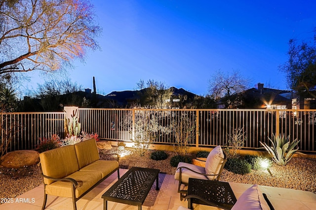 view of patio / terrace featuring an outdoor living space and fence