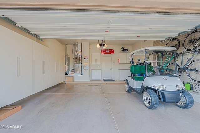 garage featuring water heater and a garage door opener