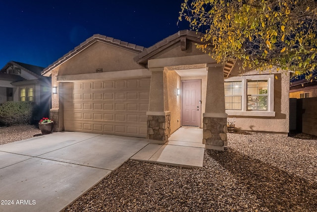 single story home with a garage