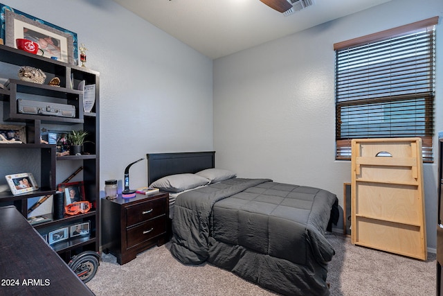 bedroom with light carpet and lofted ceiling