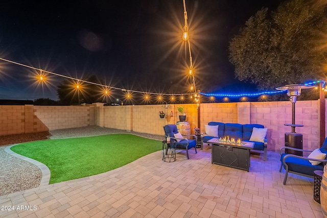 view of patio / terrace with an outdoor living space with a fire pit