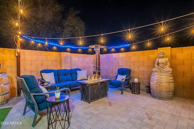 view of patio / terrace with an outdoor living space with a fire pit