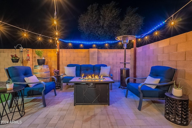 view of patio / terrace featuring an outdoor living space with a fire pit