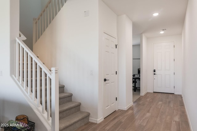 stairway featuring hardwood / wood-style floors