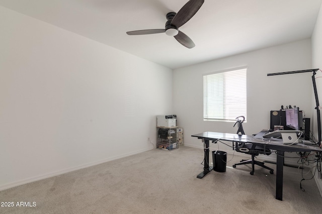 office space with light colored carpet and ceiling fan