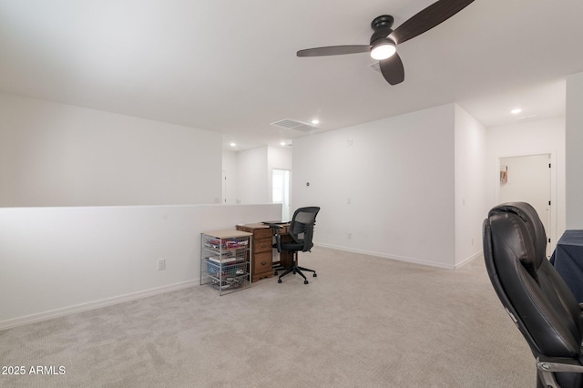 office space with light carpet and ceiling fan