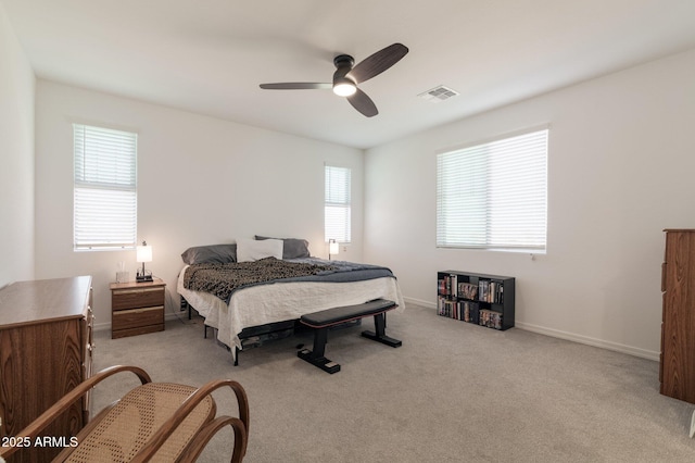 bedroom featuring light carpet and ceiling fan