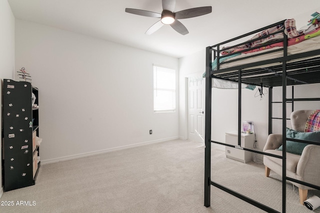 bedroom with ceiling fan and light colored carpet