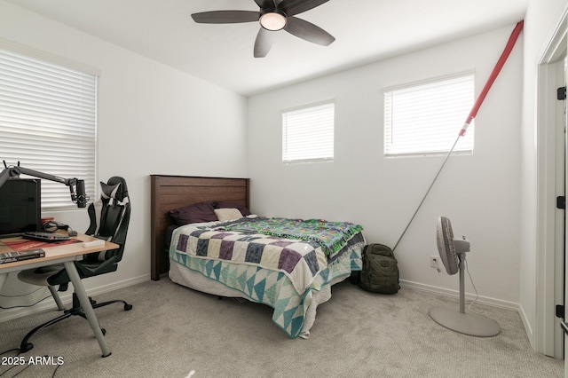 bedroom with ceiling fan and light colored carpet