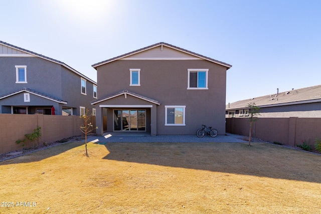 back of house featuring a patio