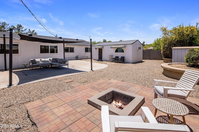 8022 E Columbus Ave, Scottsdale, AZ 85251 - view of patio / terrace featuring an outdoor living space with a fire pit and a storage shed