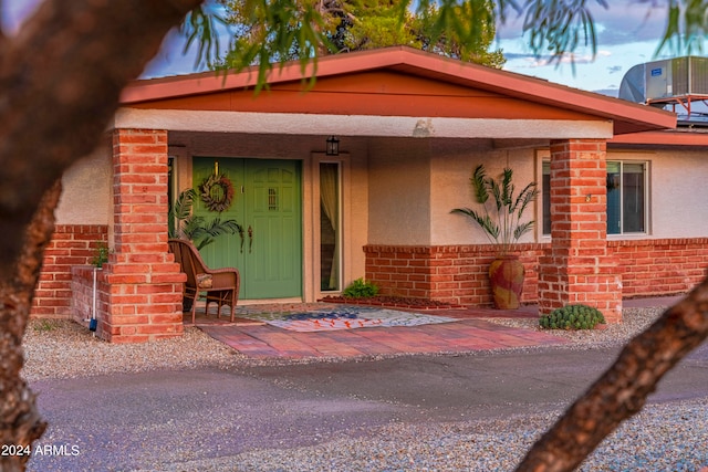 view of front of house with central air condition unit