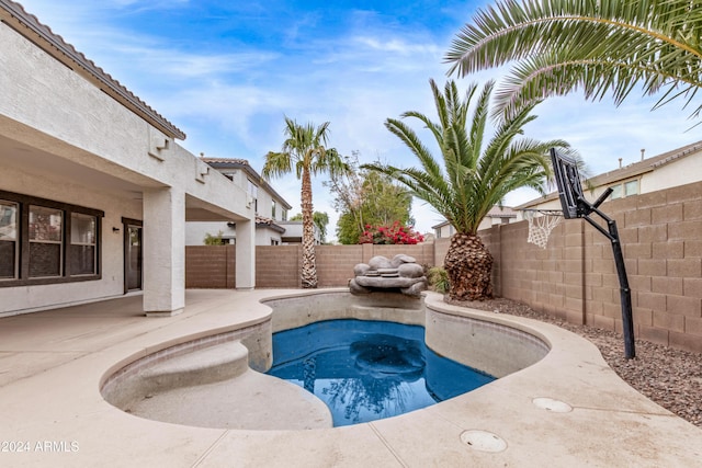 view of swimming pool featuring a patio area