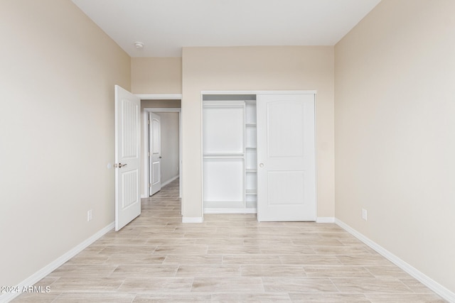 unfurnished bedroom with a closet