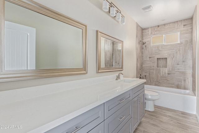 full bathroom featuring wood-type flooring, vanity, toilet, and shower / bathtub combination