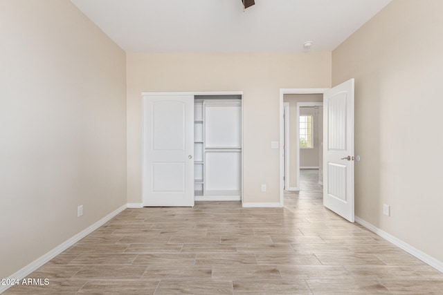 unfurnished bedroom with a closet