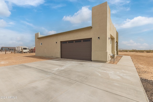 view of side of home with a garage