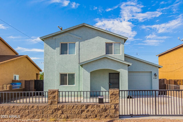 front of property with a garage