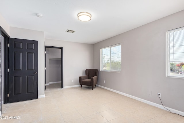 sitting room featuring light tile patterned floors