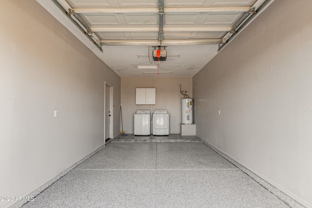 garage featuring independent washer and dryer, electric water heater, and a garage door opener