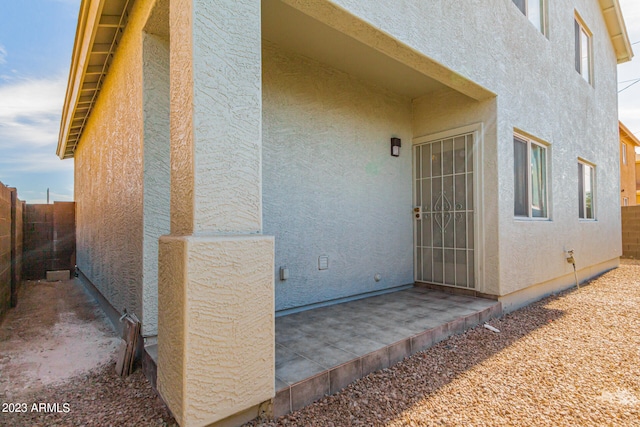 entrance to property with a patio