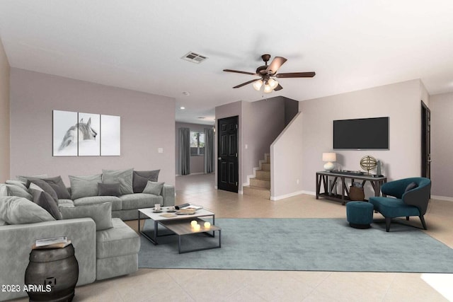 living room featuring light tile patterned floors and ceiling fan