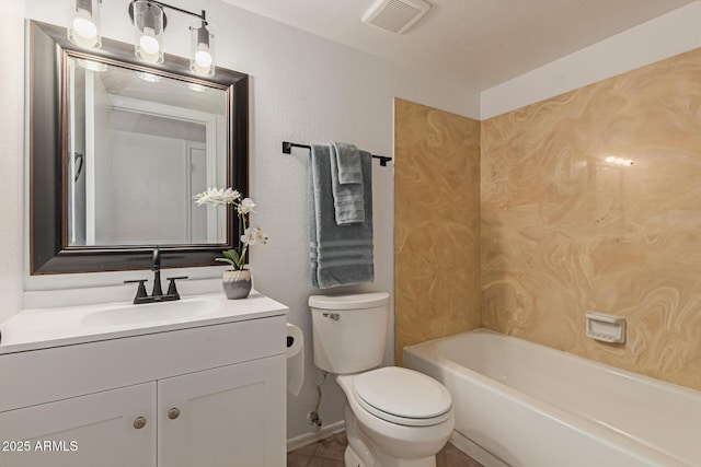 bathroom featuring visible vents, a textured wall, toilet, a bathing tub, and vanity