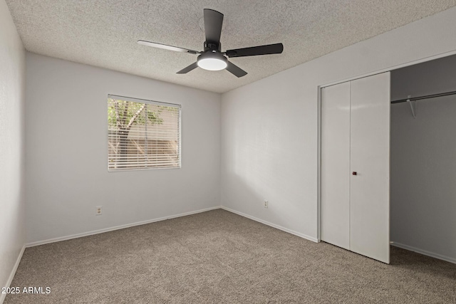 unfurnished bedroom featuring carpet floors, a closet, and a textured ceiling