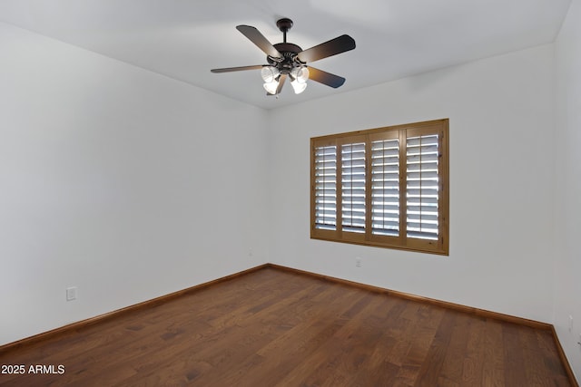 empty room with hardwood / wood-style flooring and ceiling fan