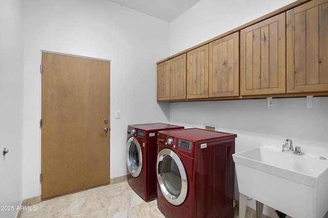 washroom featuring cabinets, sink, independent washer and dryer, and light tile patterned flooring