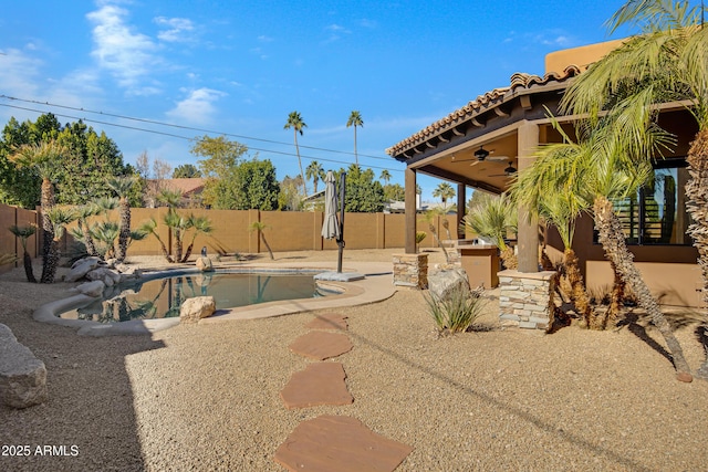 exterior space with ceiling fan and a patio