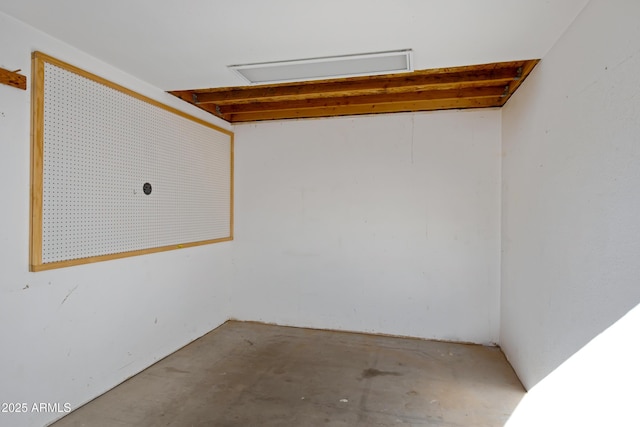 spare room featuring concrete flooring