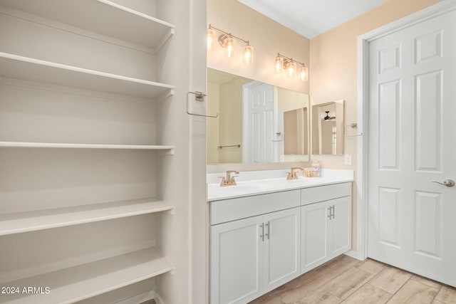 bathroom with vanity and hardwood / wood-style flooring