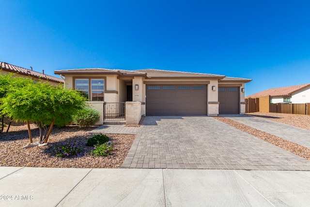 prairie-style home featuring a garage