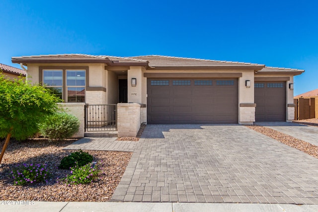 prairie-style house featuring a garage