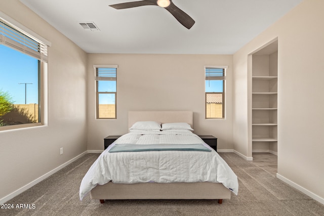 carpeted bedroom featuring ceiling fan