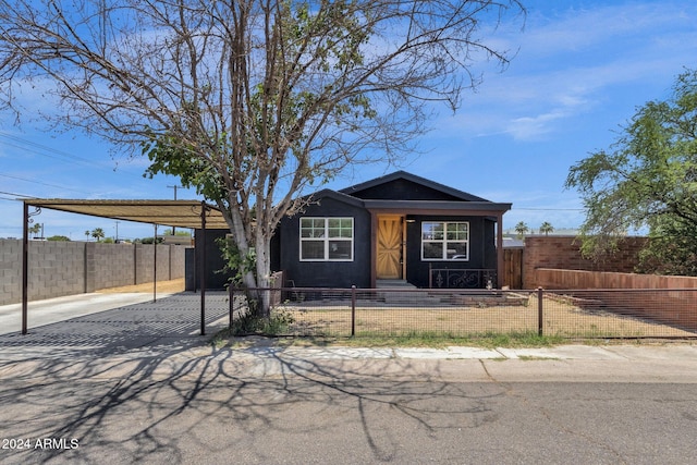 ranch-style house featuring a carport